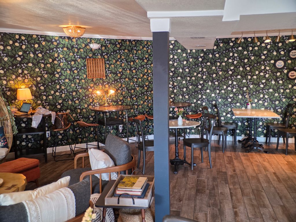 Another angle of the Gathering Grounds quiet lounge showing comfortable chairs and warm lighting.