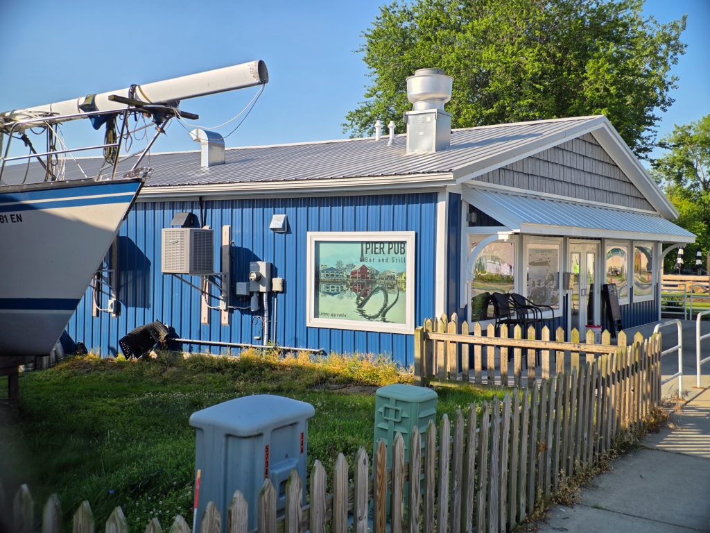  Pier Pub Bar & Grill with outdoor seating along the Huron River.