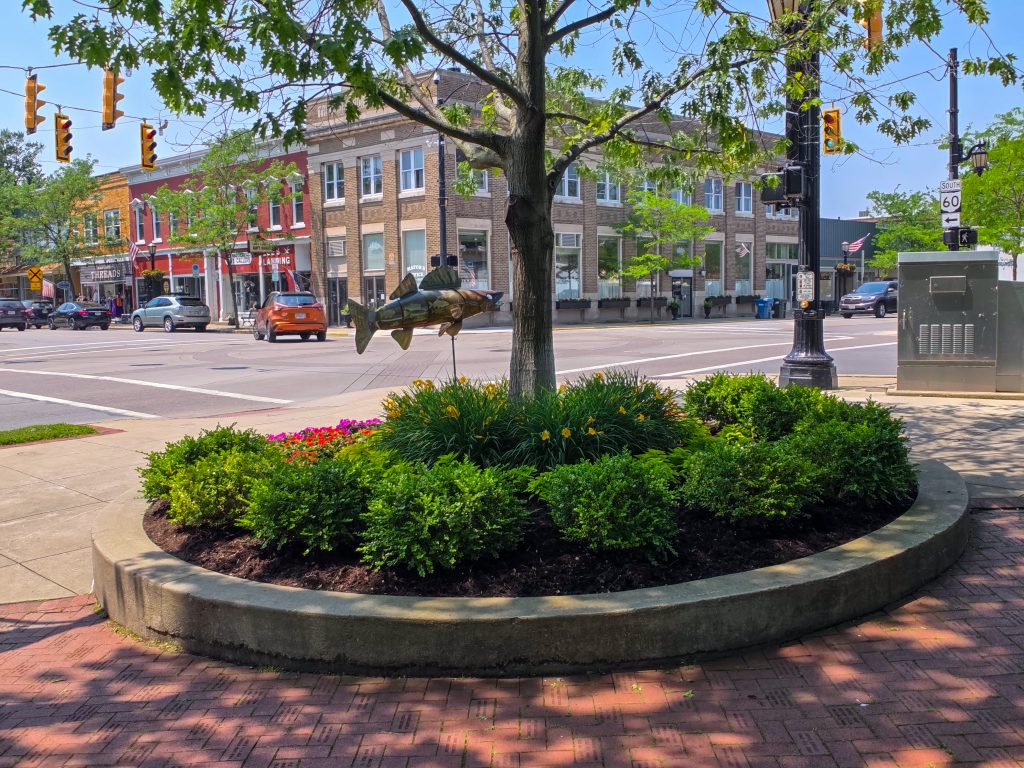 cenic view of downtown Vermilion, Ohio, from the park with fish statue in front.