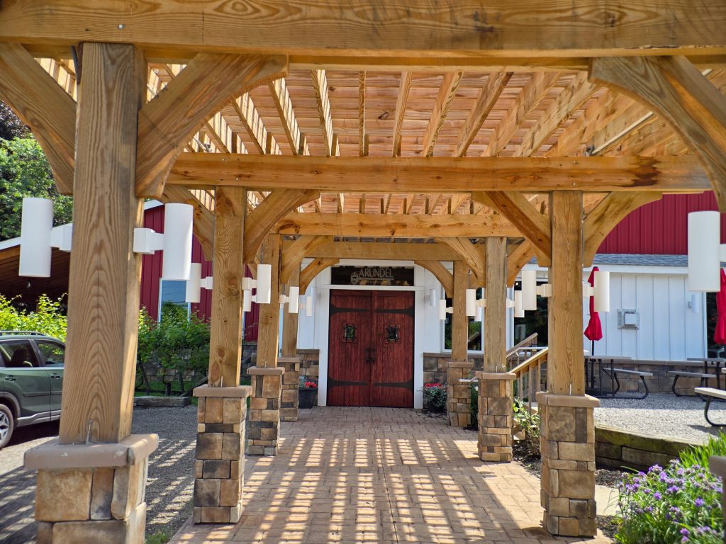 Exterior of Arundel Winery entrance in Erie, Pennsylvania with vineyard backdrop.