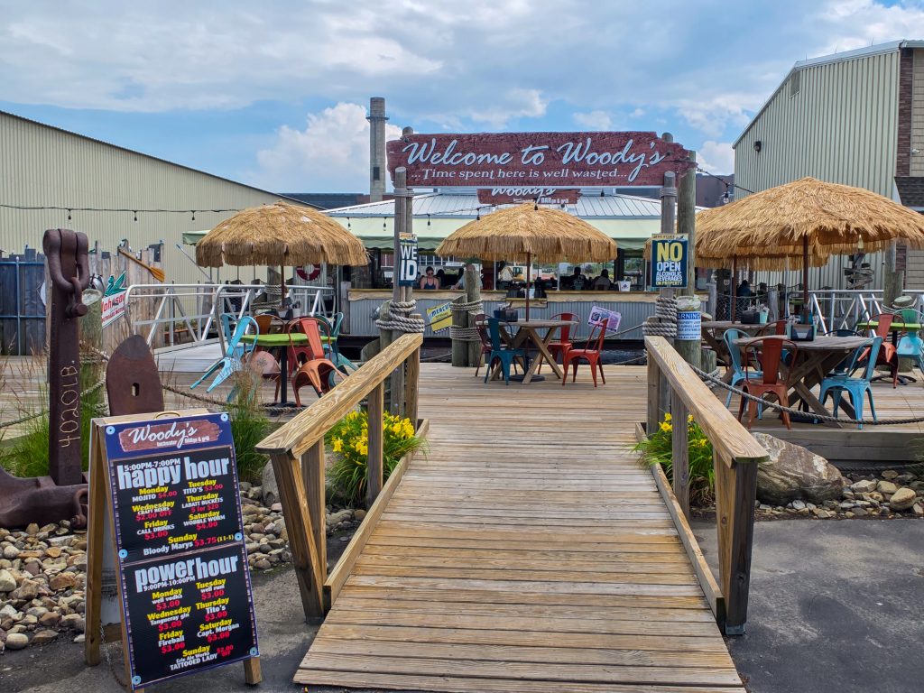 Outdoor seating and casual dining at Woody’s Bar & Grill on Erie’s Bayfront.