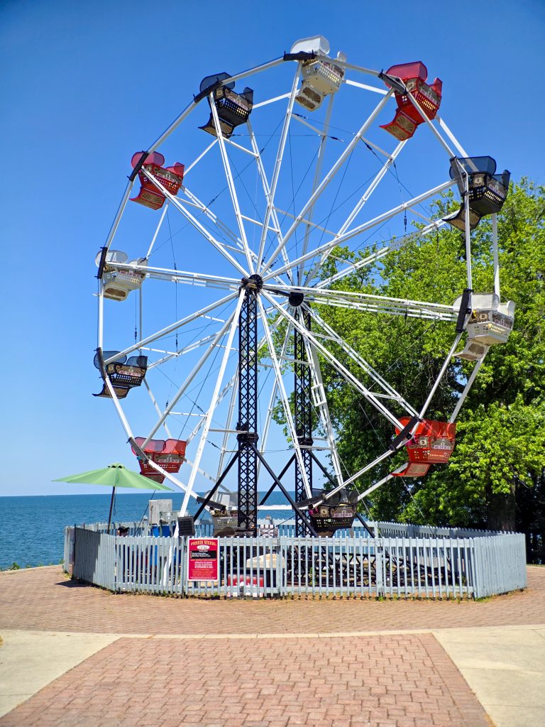 Ferris wheel at sunset behind The Old Firehouse Winery overlooking Lake Erie in Geneva-on-the-Lake, Ohio.
