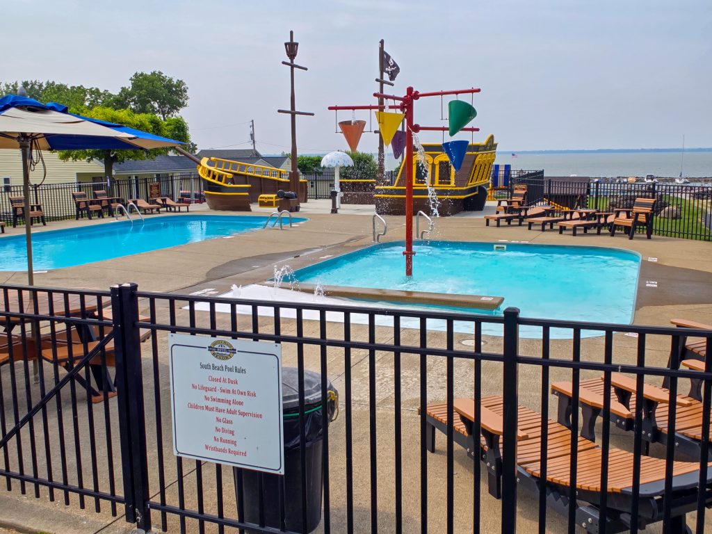 South Beach Resort pool with boats docked along the Lake Erie shoreline in Marblehead, Ohio.