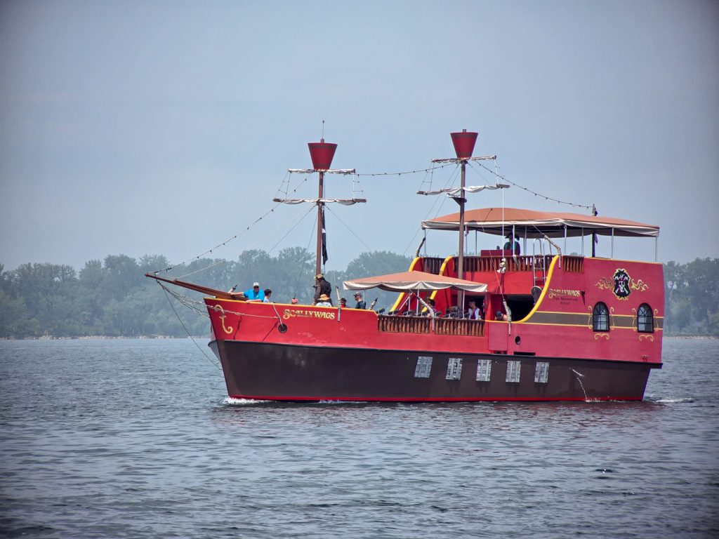 Pirate Boat tour cruising past Rum Runners restaurant in Erie