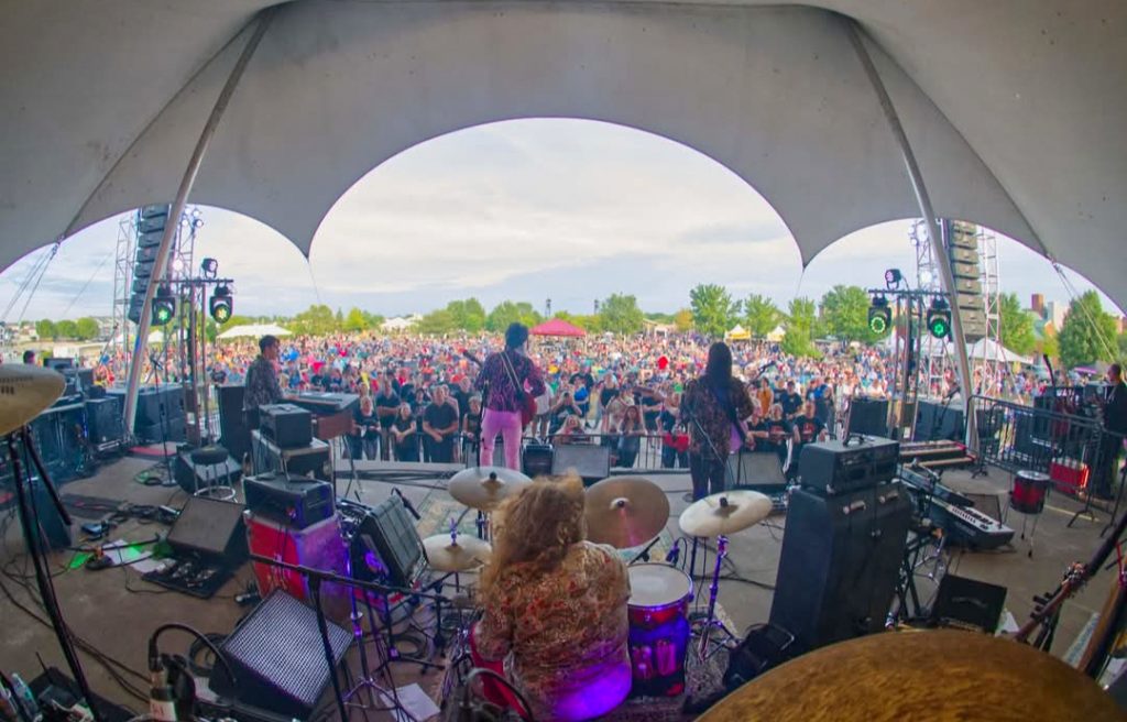 Outdoor concert crowd and band at Black River Landing in Lorain