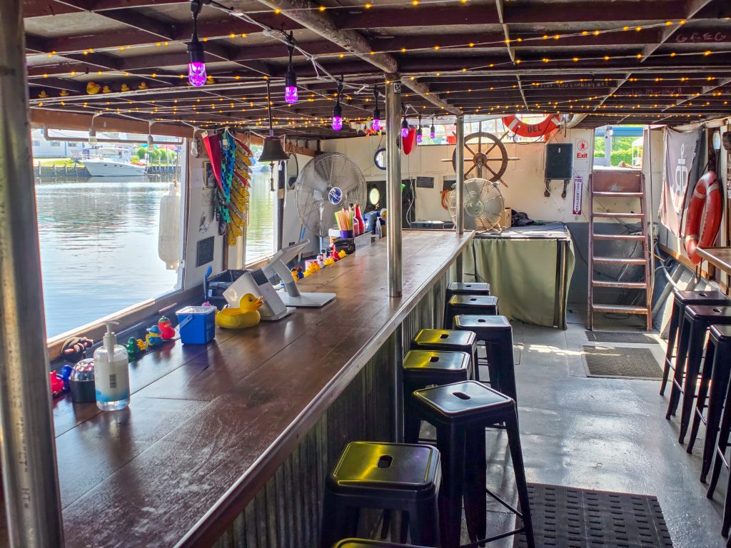 Interior seating of the Bum Boat floating bar in Ashtabula Ohio
