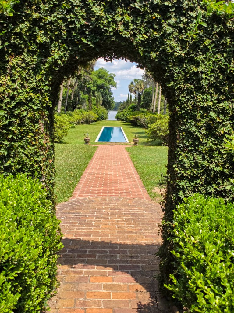 Reflecting pool surrounded by greenery at Maclay Gardens
